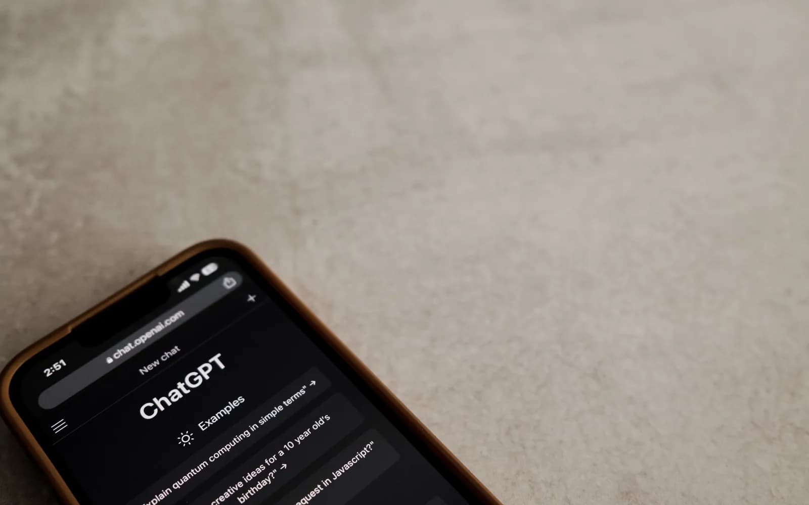 A smartphone displays the ChatGPT interface on its screen, symbolizing modern AI technology.