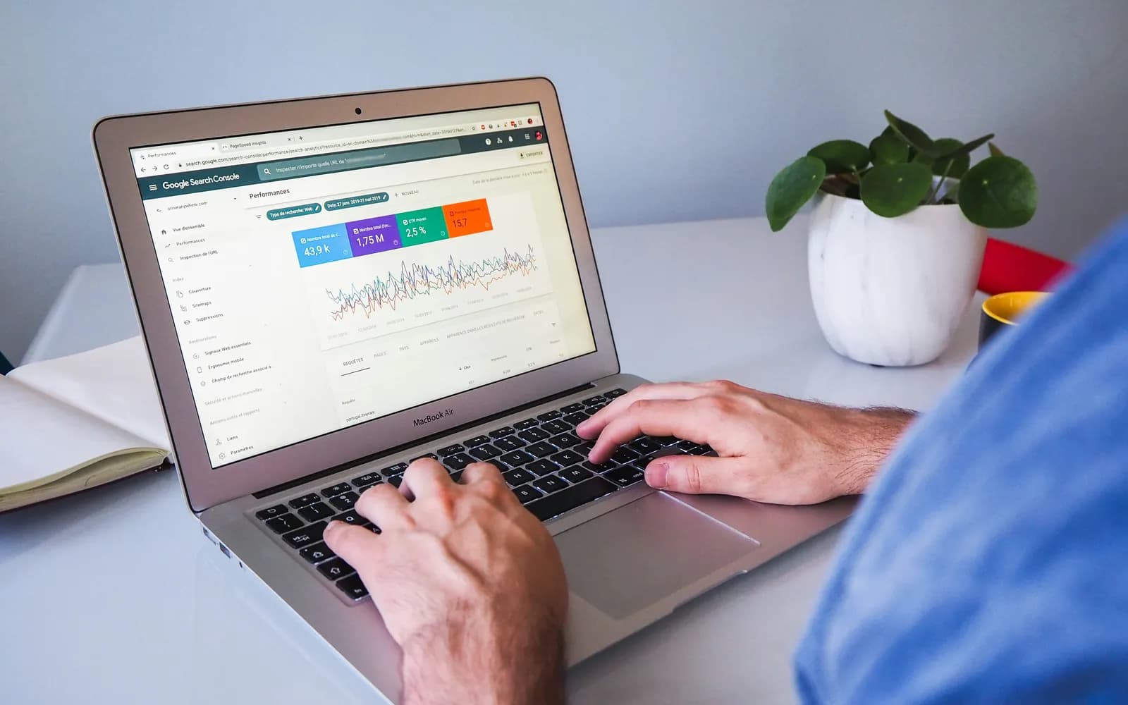 A person reviewing Google Search Console performance on a laptop.